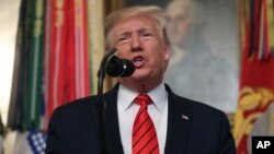President Donald Trump speaks in the Diplomatic Room of the White House in Washington, Sunday, Oct. 27, 2019. (AP Photo/Andrew Harnik)