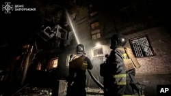 Firefighters work to extinguish a fire after a Russian attack on Zaporizhzhia, Ukraine, early Sept. 23, 2024. (Ukraine Ministry of Internal Affairs via AP)