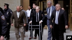 Harvey Weinstein, center, leaves court in New York, Jan. 6, 2020. 