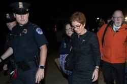 FILE - Former U.S. Ambassador to Ukraine Marie Yovanovitch, center, leaves Capitol Hill, Oct. 11, 2019, in Washington, after testifying before U.S. lawmakers.