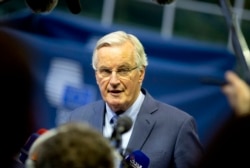 European Union chief Brexit negotiator Michel Barnier speaks with the media as he arrives for a meeting of EU General Affairs ministers, Article 50, at the European Convention Center in Luxembourg, Oct. 15, 2019.