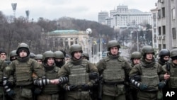 Police try to block supporters of former Georgian president Mikheil Saakashvili during a rally in Kyiv, Ukraine, Dec. 5, 2017.