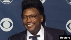 FILE - Singer Otis Rush poses with the Grammy Award he won for Best Traditional Blues Album for "Any Place I'm Going," Feb. 24, 1999, at the Grammy Awards in Los Angeles.