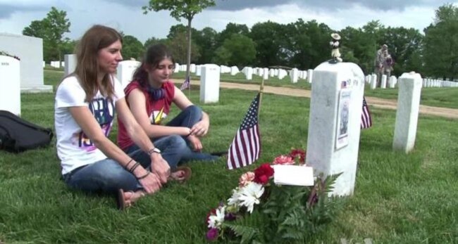 Soldiers Place US Flags in Arlington Cemetery for Memorial Day