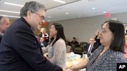 U.S. Attorney General William Barr, left, greets Vivian Korthius with the Association of Village Council Presidents at a discussion at the Alaska Native Tribal Health Consortium, May 29, 2019, in Anchorage, Alaska, where participants discussed public safety concerns in Alaska.