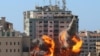 The al-Jalaa building housing Associated Press (AP) and Al Jazeera media offices is hit by an Israeli air strike in Gaza City, May 15, 2021. 