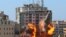 The al-Jalaa building housing Associated Press (AP) and Al Jazeera media offices is hit by an Israeli air strike in Gaza City, May 15, 2021. 