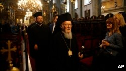 Ecumenical Patriarch Bartholomew I, the spiritual leader of the world's Orthodox Christians, leaves the Patriarchal Church of St. George, following Sunday services in Istanbul, Oct. 7, 2018. 