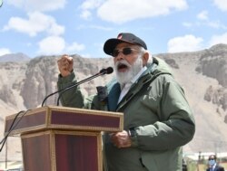 India's Prime Minister Narendra Modi gestures as he speaks to Indian troops during his visit to Nimu in the union territory of Ladakh, in this handout photograph taken July 3, 2020, and released by the Indian Press Information Bureau.