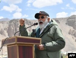 India's Prime Minister Narendra Modi gestures as he speaks to Indian troops during his visit to Nimu in the union territory of Ladakh, in this handout photograph taken July 3, 2020, and released by the Indian Press Information Bureau.