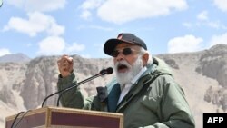 India's Prime Minister Narendra Modi gestures as he speaks to Indian troops during his visit to Nimu in the union territory of Ladakh, in this handout photograph taken July 3, 2020, and released by the Indian Press Information Bureau.