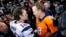 New England Patriots quarterback Tom Brady, left, and Denver Broncos quarterback Peyton Manning speak to one another following the NFL football AFC Championship game between the Denver Broncos and the New England Patriots, Jan. 24, 2016.