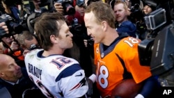 New England Patriots quarterback Tom Brady, left, and Denver Broncos quarterback Peyton Manning speak to one another following the NFL football AFC Championship game between the Denver Broncos and the New England Patriots, Jan. 24, 2016.