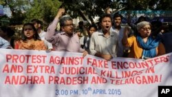 Activists shout slogans during a protest against two separate incidents of police killings on Tuesday in southern India, in New Delhi, India, Friday, April 10, 2015.