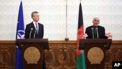 Afghan President Ashraf Ghani (R) speaks as NATO Secretary General Jens Stoltenberg listens during a joint press conference at the Presidential Palace in Kabul, Afghanistan, March 15, 2016.