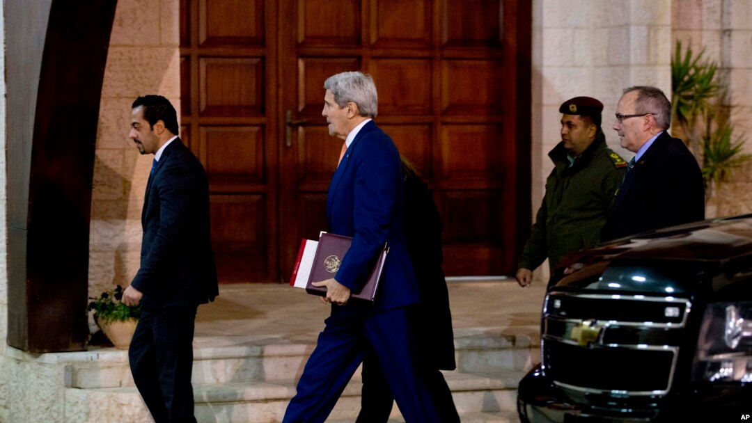 U.S. Secretary of State John Kerry, center, arrives to the West Bank city of Ramallah, Tuesday, Nov. 24, 2015, to meet with Palestinian President Mahmoud Abbas.