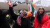 Supporters of former Ivory Coast president Laurent Gbagbo celebrate outside the International Criminal Court in The Hague, the Netherlands, Feb.1, 2019.
