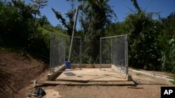 FILE - A view of an area prepared by residents for the installation of a pledged generator that never materialized, in Corozal, Puerto Rico, March 13, 2018. 