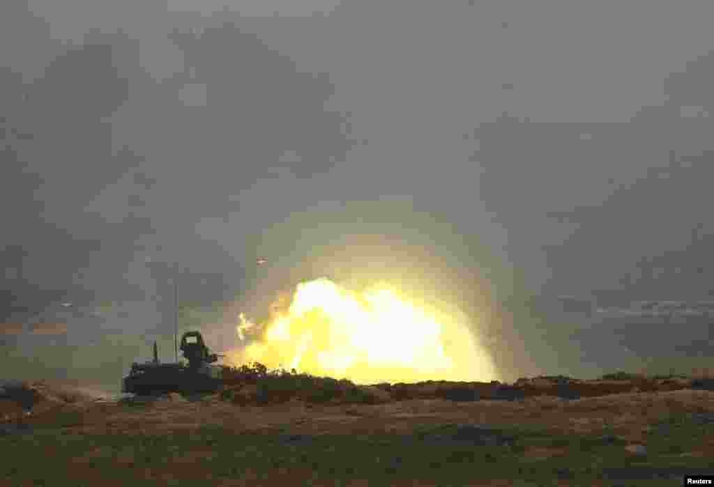 An armored vehicle fires during the Zapad 2017 war games at a range near the town of Borisov, Belarus.