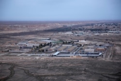 FILE - This Dec. 29, 2019, aerial file photo shows the al-Asad air base in the western Anbar desert, Iraq.