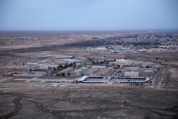 FILE - This Dec. 29, 2019, aerial file photo shows the al-Asad air base in the western Anbar desert, Iraq.