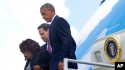 President Barack Obama, with Rep. Corrine Brown, D-Fla., left, and Sen. Marco Rubio, R-Fla., center, get off Air Force One upon their arrival at Orlando International Airport, in Florida, June 16, 2016.