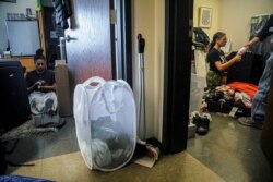 FILE - Princeton University students pack their rooms to leave after the institution shutdown campus with plans to continue instruction online due to COVID-19, in Princeton, N.J., March 14, 2020.