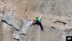 This takes guts! In this 2015 photo, Kevin Jorgeson climbs El Capitan in California's Yosemite National Park. This has been called the hardest rock climb in the world. (PHOTO Tom Evans)