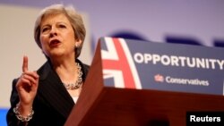 British Prime Minister Theresa May delivers her keynote address on the final day of at the Conservative Party Conference in Birmingham, Britain, Oct. 3, 2018.