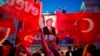 Supporters of Turkey's President Recep Tayyip Erdogan gather for a rally outside the Presidential Palace, in Ankara, Turkey, April 17, 2017.