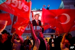 FILE - Supporters of Turkey's President Recep Tayyip Erdogan gather for a rally in Ankara, Turkey, April 16, 2017