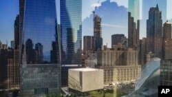 FILE - A box-shaped building, center, wrapped in translucent marble panels, is home to the new Perelman Performing Arts Center theater complex on the grounds of the World Trade Center, Wednesday Sept. 6, 2023, in New York.