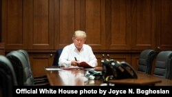 President Donald J. Trump works in his conference room at Walter Reed National Military Medical Center in Bethesda, Md., Oct. 3, 2020, after testing positive for COVID-19. (Official White House photo by Joyce N. Boghosian)