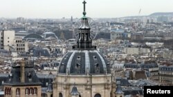 FILE - A city view shows the dome at La Sorbonne University as part of the skyline in Paris, France, March 30, 2016. 