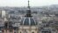 FILE - A city view shows the dome at La Sorbonne University as part of the skyline in Paris, France, March 30, 2016. 