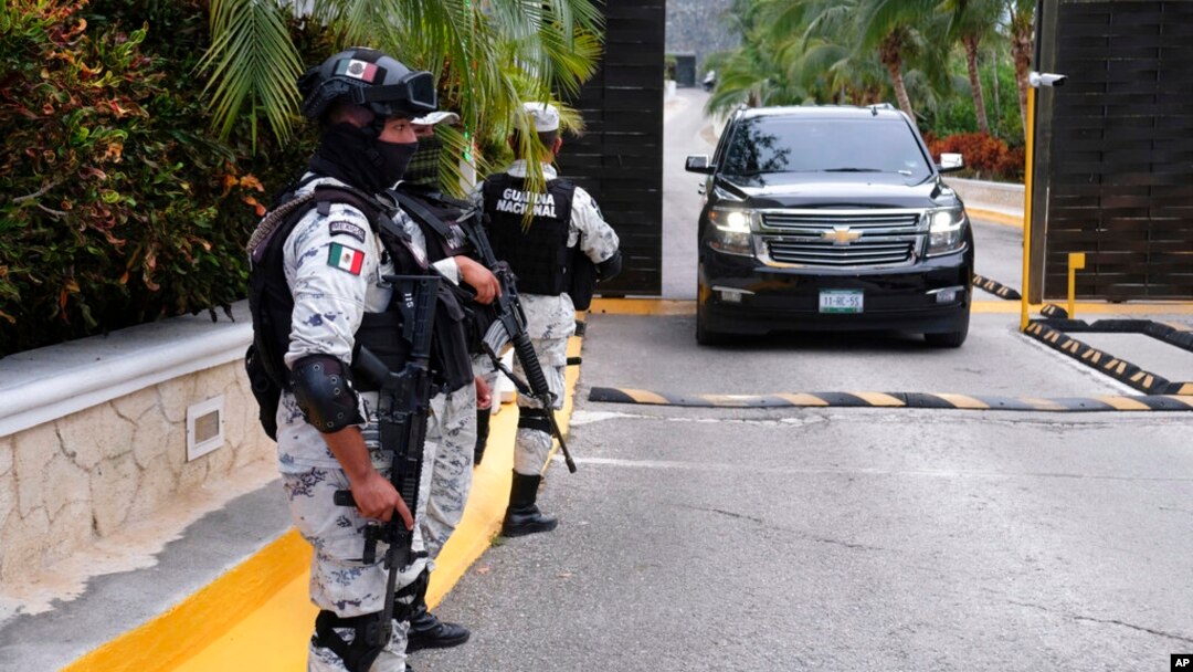 Government forces guard the entrance of hotel after an armed confrontation near Puerto Morelos, Mexico, Nov. 4, 2021. Two suspected drug dealers were killed.