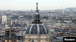 FILE- A city view shows the dome at La Sorbonne University as part of the skyline in Paris, France, March 30, 2016. 