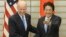 U.S. Vice President Joe Biden, left, is welcomed by Japanese Prime Minister Shinzo Abe prior to their talks at Abe's official residence in Tokyo, Dec. 3, 2013. 