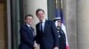 French President Emmanuel Macron, left, greets NATO Secretary General Mark Rutte as he arrives for an informal meeting of leaders from key European Union nations and the United Kingdom at the Elysee Palace in Paris, Feb. 17, 2025.