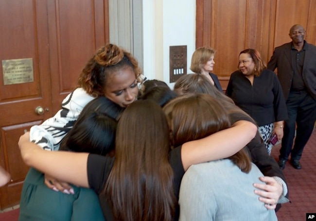 This image taken from video shows singer Jennifer Hudson embracing student journalists from Marjory Stoneman Douglas High School in Parkland, Fla., who were recognized at the 2019 Pulitzer Prize winners awards luncheon at Columbia University in New York, May 28, 2019.