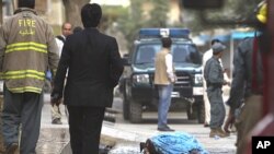 The body of a Taliban insurgent lays outside the house of Jan Mohammad Khan, who was killed by armed gunmen during Sunday's attack in Kabul, July 18, 2011