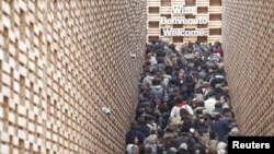 Visitors queue outside the Poland pavilion at the Expo 2015 global fair in Milan, Italy, Oct. 29, 2015. 