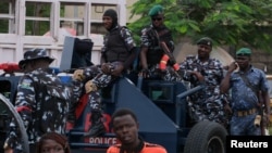 Nigerian police restrict demonstrators from convening for a sixth day of protests against the government, in Lagos, Nigeria, Aug. 6, 2024.