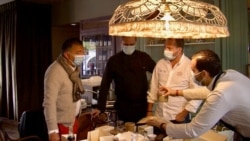 Restaurant owner Hakim Gaouaoui and his staff are sampling food for their upcoming venture offering deliveries and takeaways as restaurant dining rooms remain closed. (Photo: Lisa Bryant / VOA)