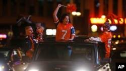 Denver Broncos fans celebrate their team's victory over the Carolina Panthers in Super Bowl 50 late Sunday, Feb. 7, 2016, in Denver. 