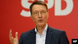 Designated new German Health Minister Karl Lauterbach of the Social Democratic Party, SPD, speaks during a news conference at the party's headquarters in Berlin, Dec. 6, 2021. 