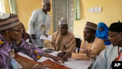 Electoral officials compile voting results at a collation center in Kano, northern Nigeria, Feb. 24, 2019.