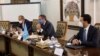 Rafael Mariano Grossi, Director General of International Atomic Energy Agency, IAEA, center, attends a meeting with the Head of Atomic Energy Organization of Iran, Mohammad Eslami, in Tehran, Iran, Sept. 12, 2021.