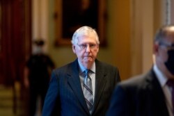 Senate Minority Leader Mitch McConnell arrives as the $1 trillion bipartisan infrastructure package is about to be voted on by the Senate in Washington, Aug. 10, 2021.