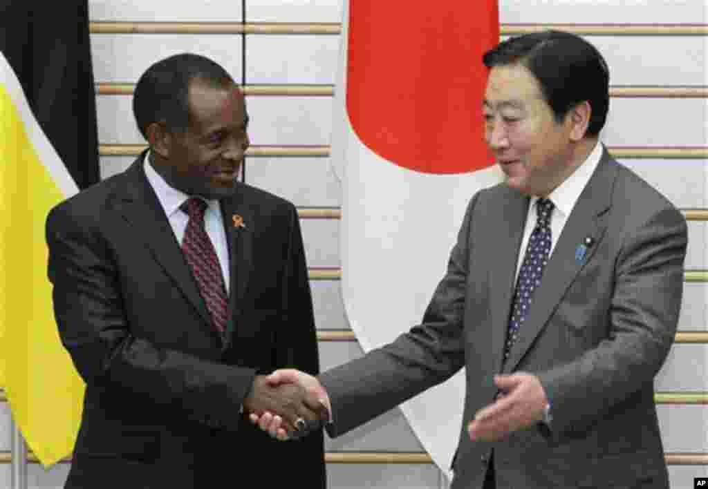 Mozambique's Prime Minister Aires Bonifacio Baptista Ali, left, shakes hands with Japan's counterpart Yoshihiko Noda at the latter's official residence in Tokyo Tuesday, Feb. 21, 2012.